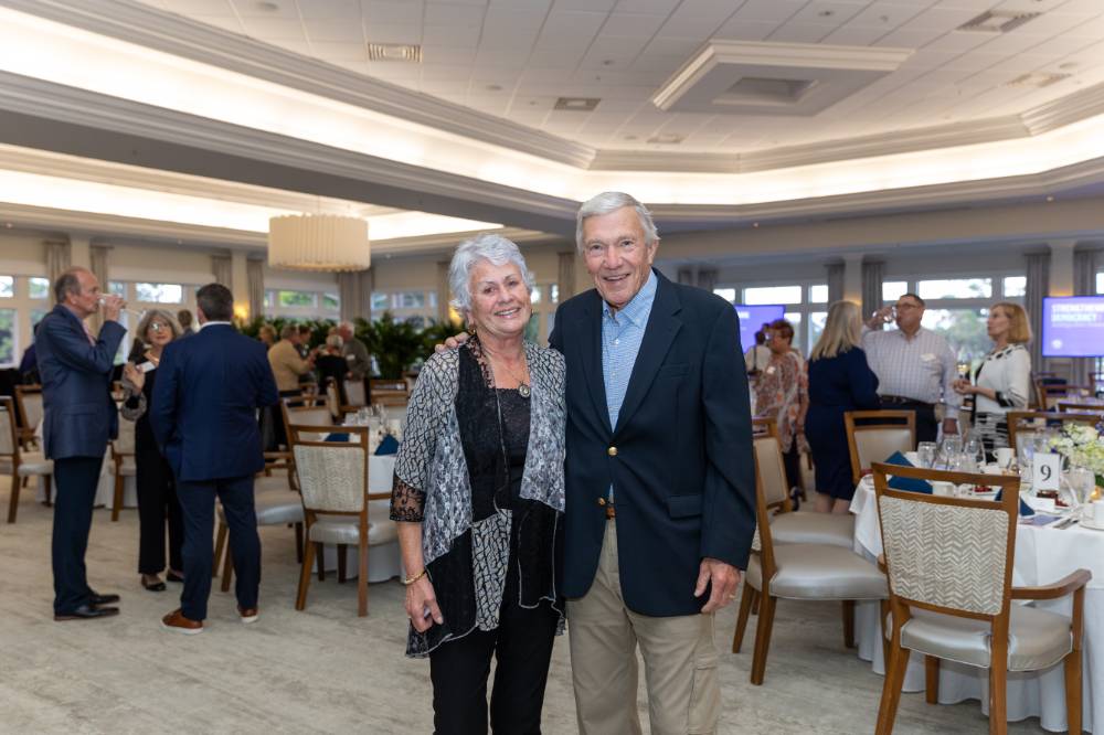 Two event guests smiling at the camera